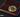 close-up image of a bitcoin coin resting on a dark cryptocurrency wallet, symbolizing digital currency security and privacy in crypto transactions