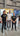 Three people standing in front of a 'Crayters' branded backdrop