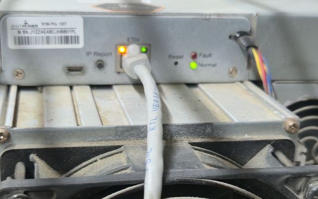 A miner's control board with Ethernet connected and the Normal light on