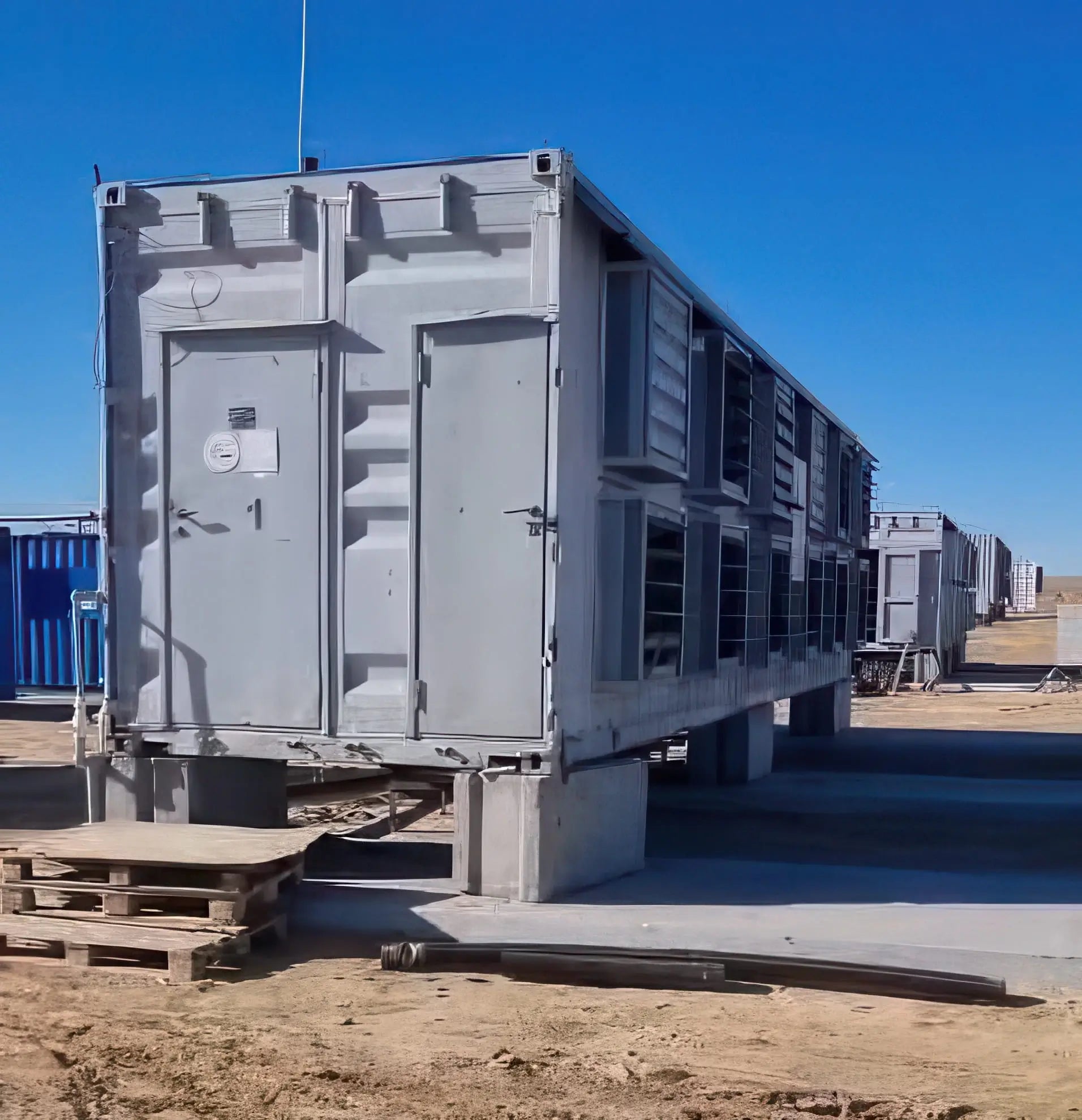 A containerized OneMiners deployment — turnkey units arrive wired, cooled and ready for hardware.