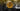 Gold Bitcoin coin on a blurred background with 'oneminers' branding.