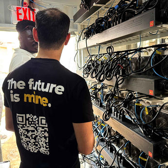 Team inspecting mining rigs in Nigeria with "The future is mine" t-shirt.