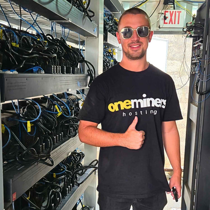 OneMiners hosting in Nigeria with a person wearing a branded t-shirt.