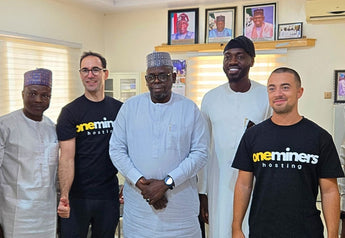 Meeting with Nigerian representatives, with OneMiners hosting shirts worn.