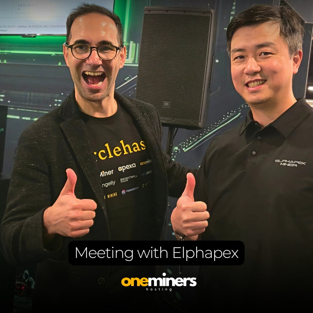 OneMiners team meeting with Elphapex partner at event, thumbs up.