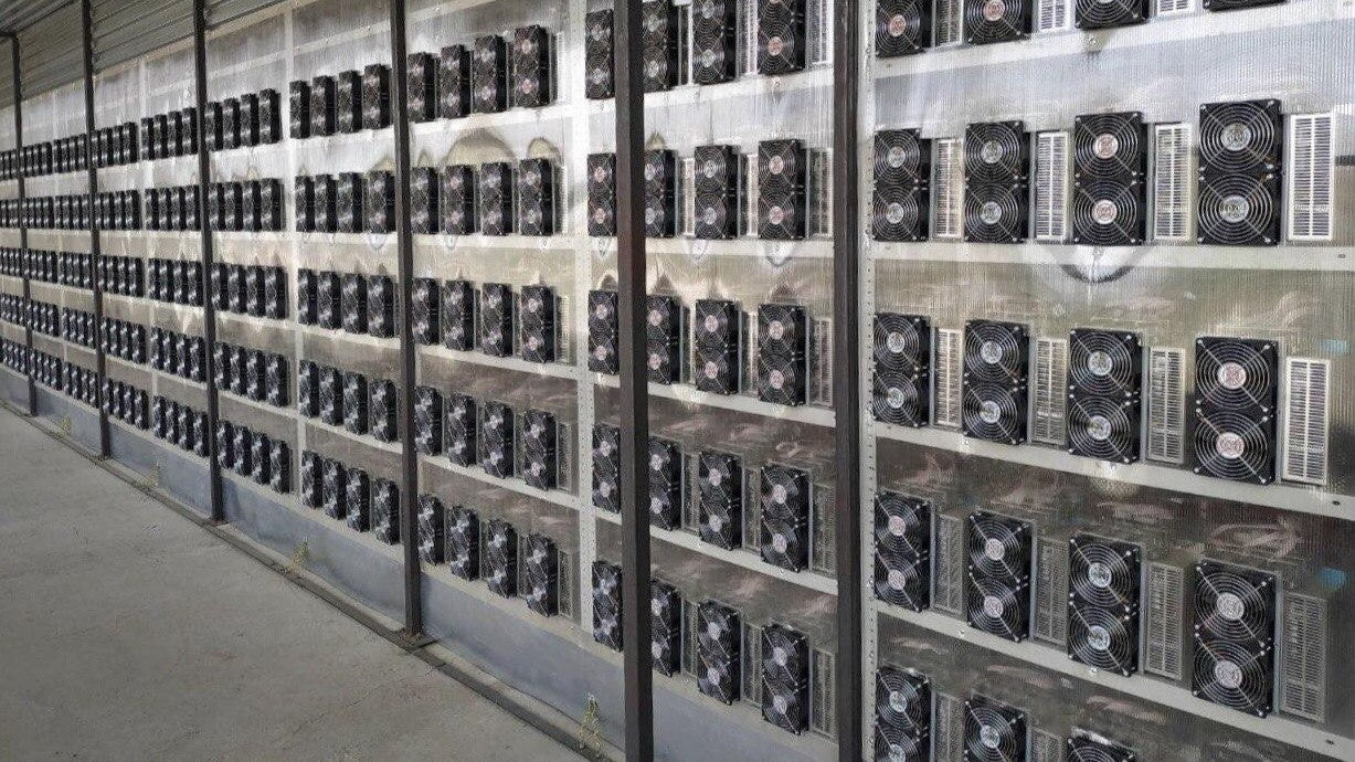 Mining operation with multiple mining rigs stacked in a hosting facility in Paraguay.